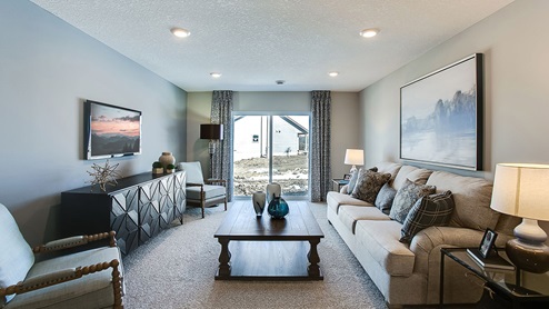 The lower level basement is finished with a family room, bedroom and bath.