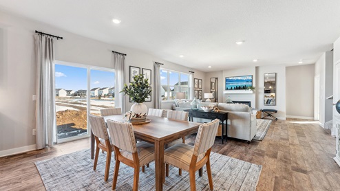 dining room next to the kitchen with a rectangular table, with six chairs surrounding