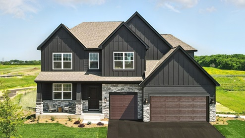 Front exterior of a two story home with black siding, a three car garage and a covered front porch