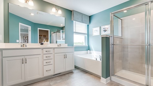 Bedroom suite bath includes a separate tub and shower.
