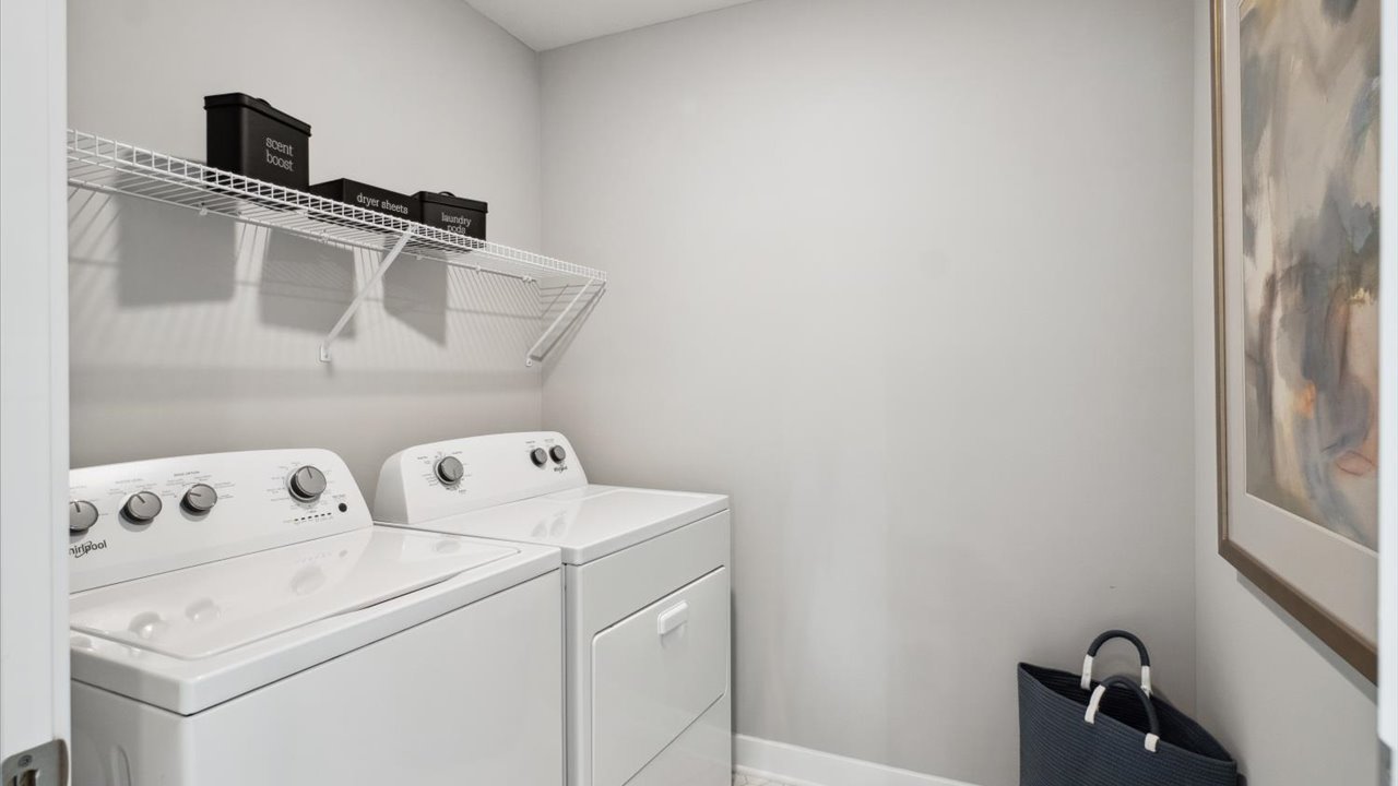 Laundry room with Whirpool appliances.