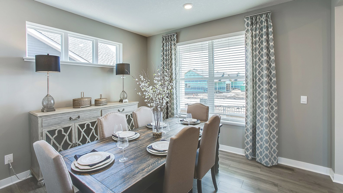 View of open concept main level with 6-person dining room.