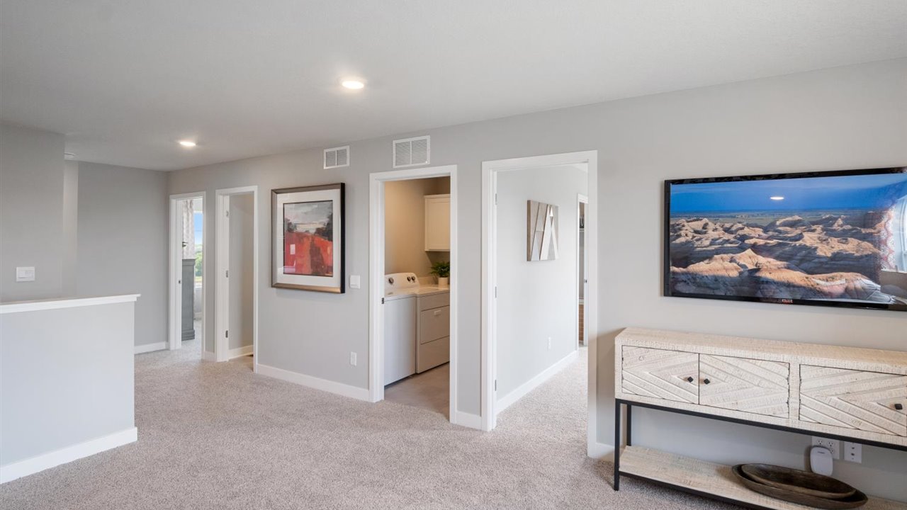 Upper level has 4 bedrooms, laundry room and a loft.