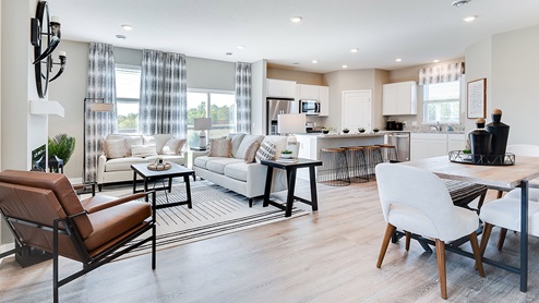 Open concept floor plans share the family room, dining and kitchen.