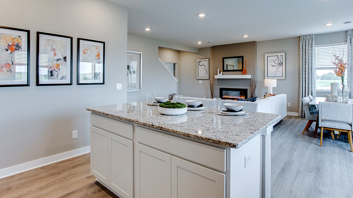 kitchen with white cabinetry, large island, and stainless steel appliances