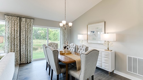 The dining area is spacious and can hold a large table seating six or more.
