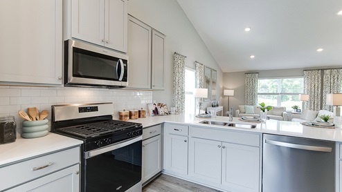 Main levels of these homes have a vaulted ceiling opening up the room to feel spacious and light.
