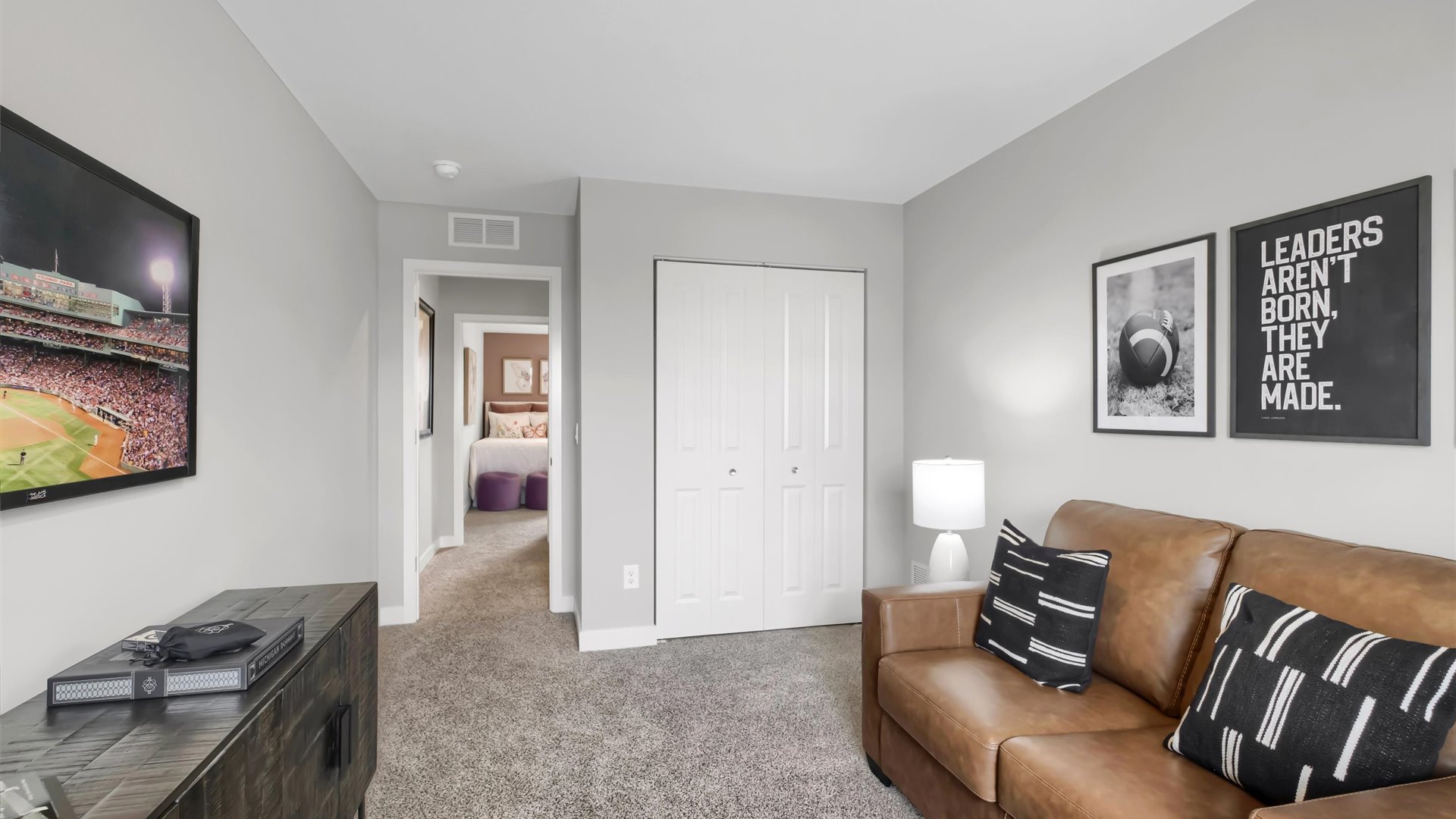 Carpeted upper level loft area.