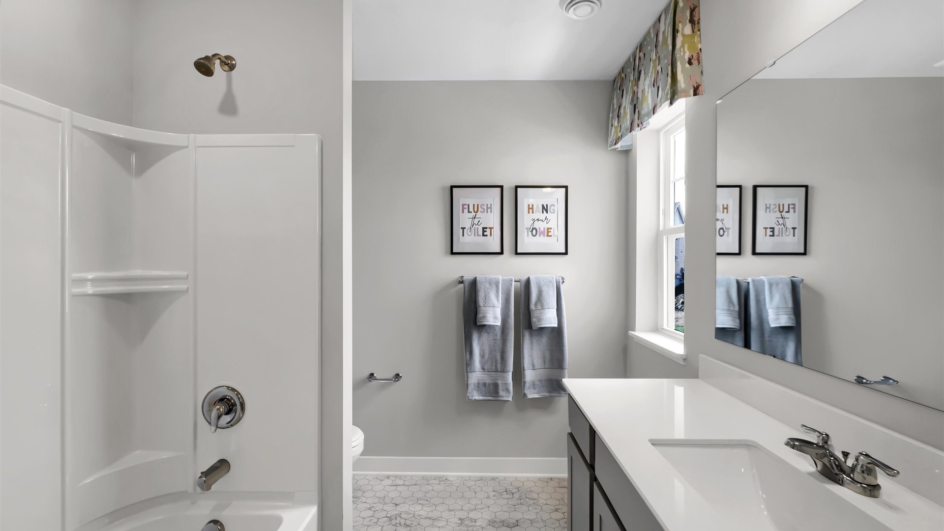 bathroom with a vanity sink, toilet and shower