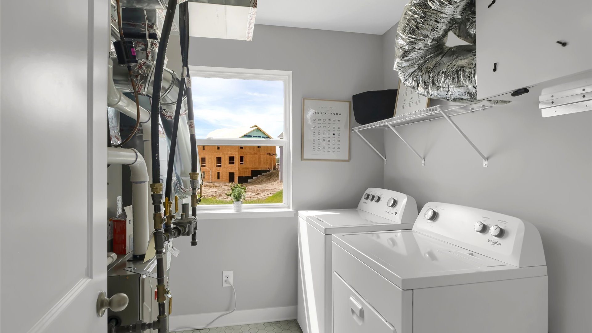 laundry room with side by side washer and dryer