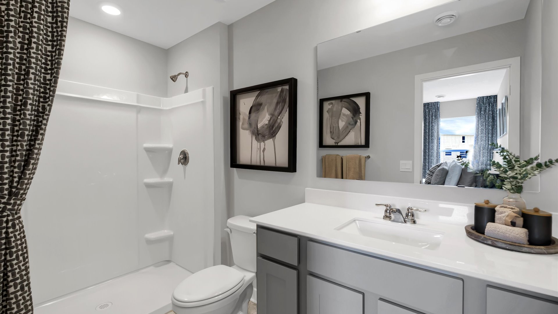 bathroom with a vanity sink, toilet and shower