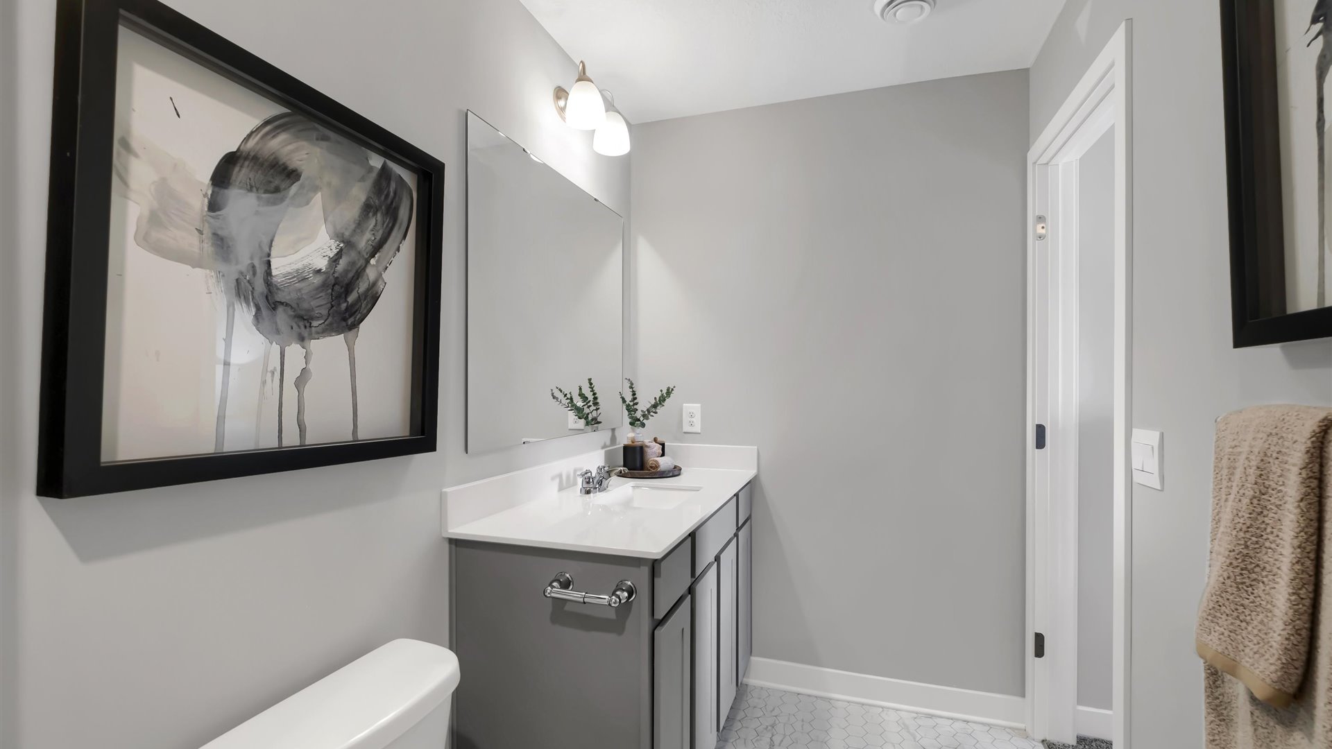 bathroom with a vanity sink, toilet and shower