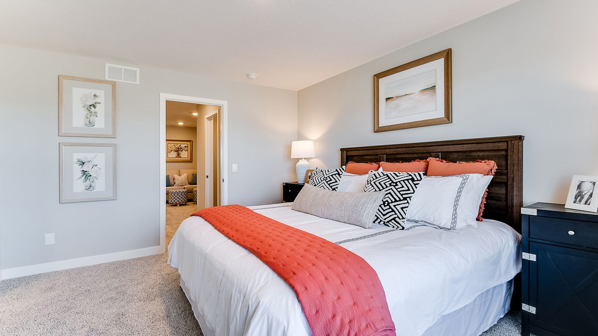 Bedroom suite with walk-in closet and private bathroom.
