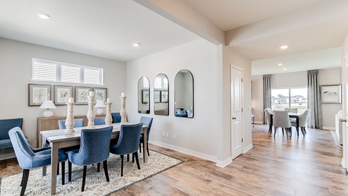 Formal dining room with hard flooring.