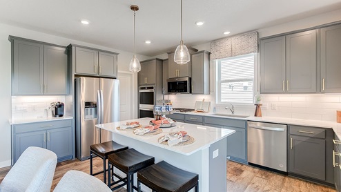 Gray cabinetry is stunning in the kitchen.