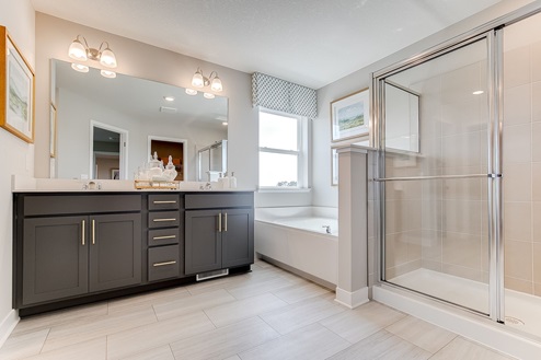 The bedroom suite has a private bath with a separate tub and shower.