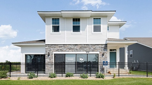 Street view of the Elder sales model at Prairie Pointe by D.R. Horton.