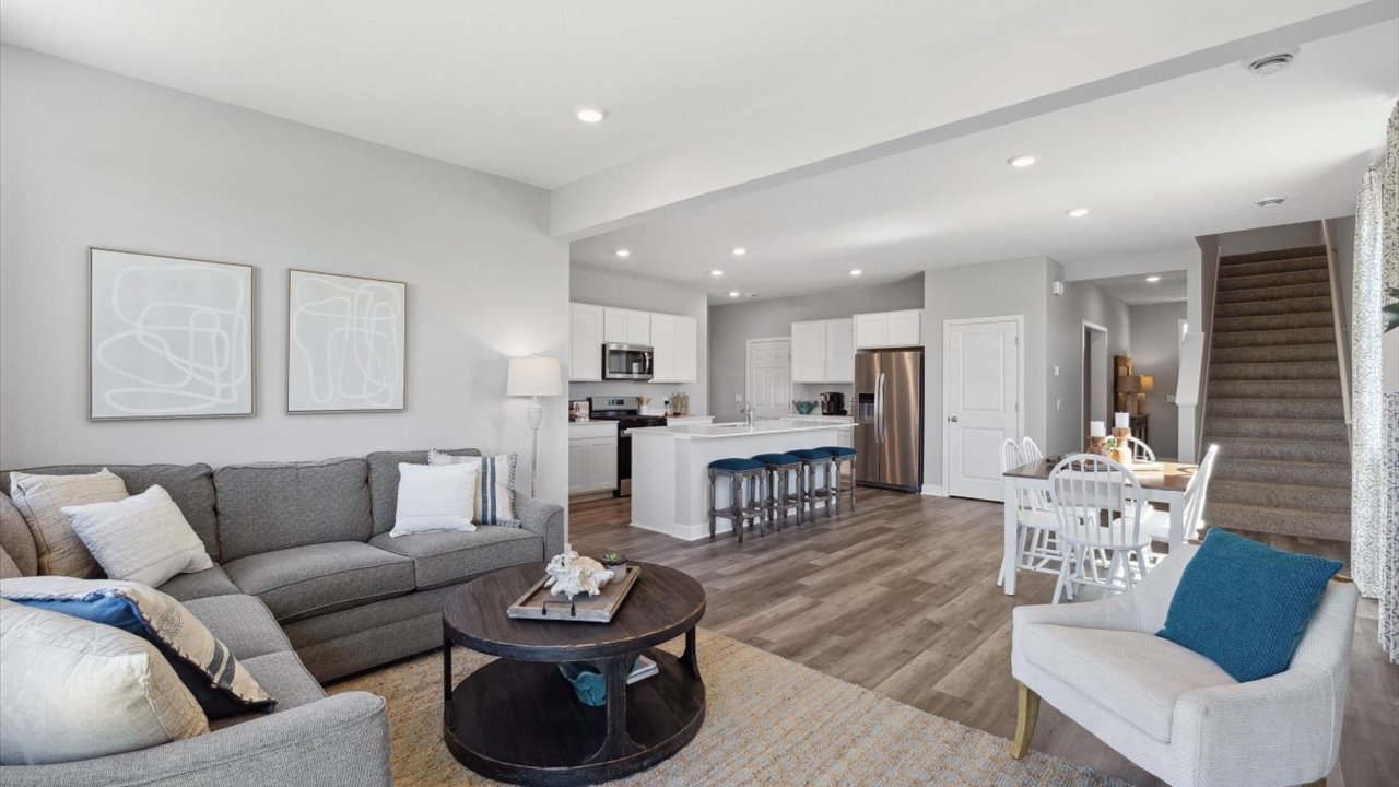 Open concept main level with view of dinette and living space.