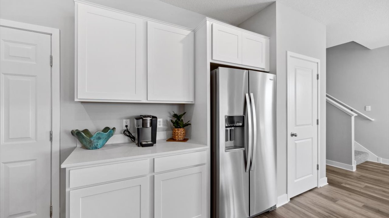 Kitchen with white cabinets and stainless steel appliances.