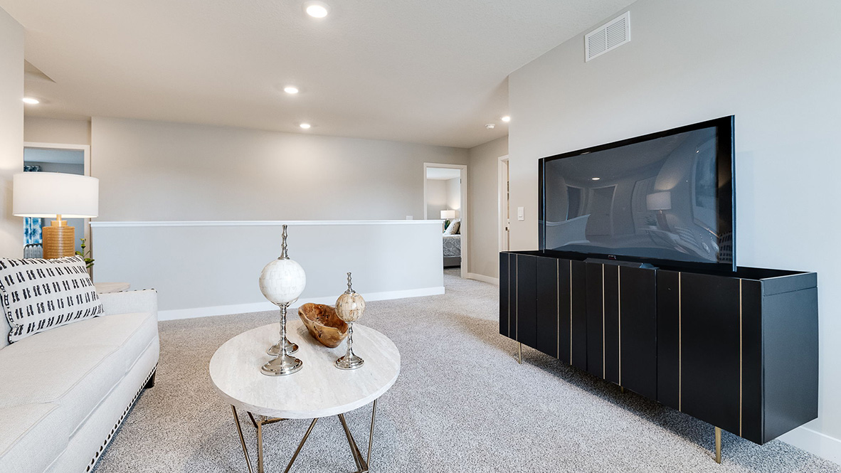 Carpeted upper level loft area.