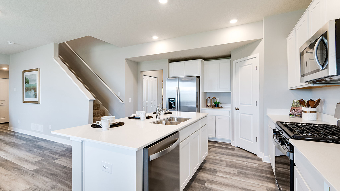 Kitchen island with stainless steel dishwasher.
