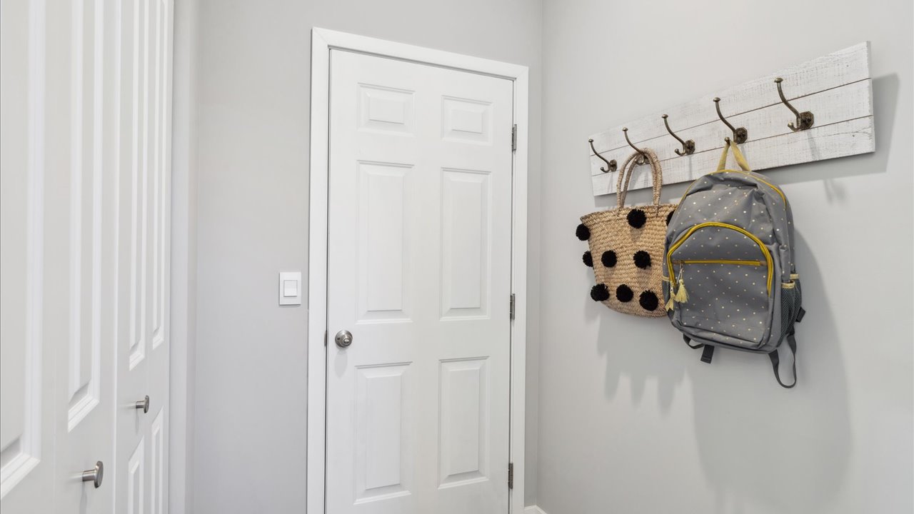 Garage entry area with closet