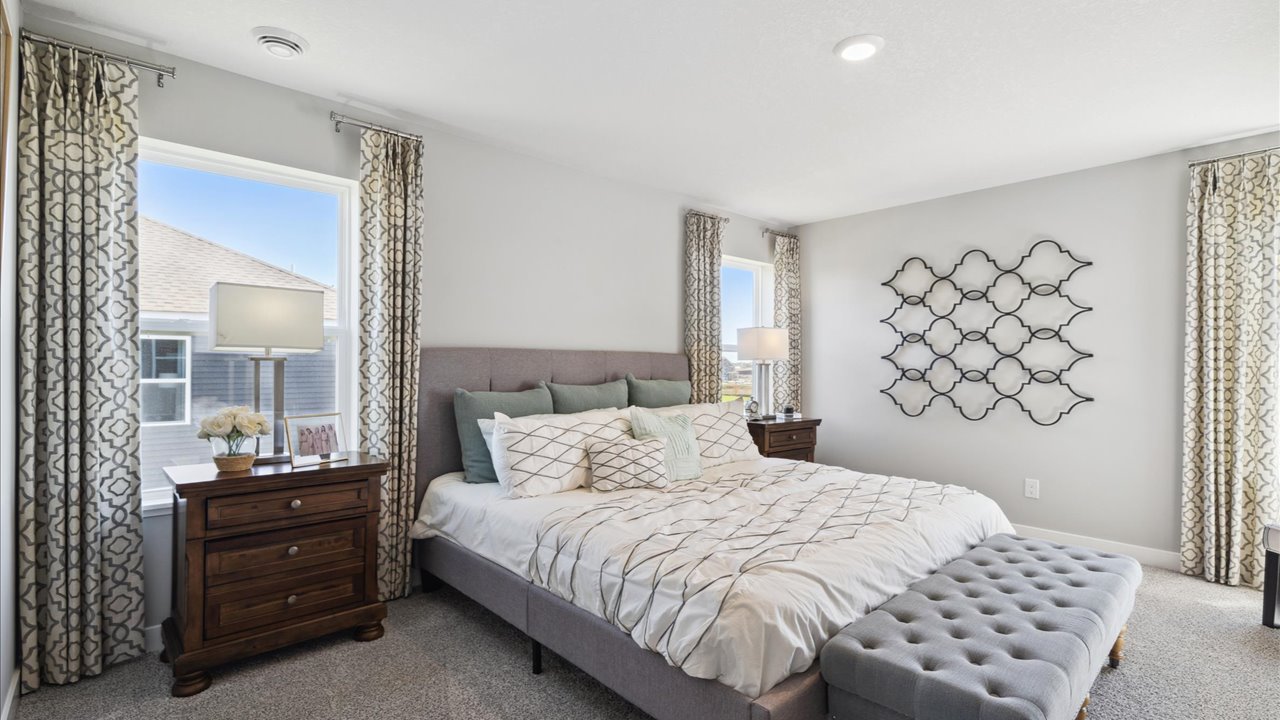 Bedroom suite with private bathroom and walk-in closet.