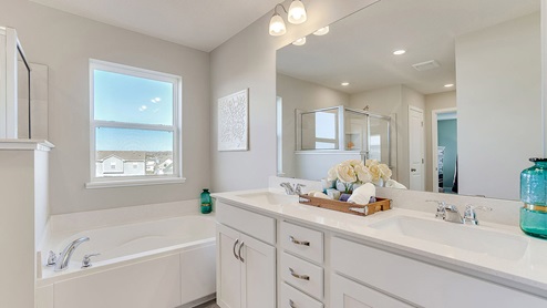 Private bath with separate tub and shower.