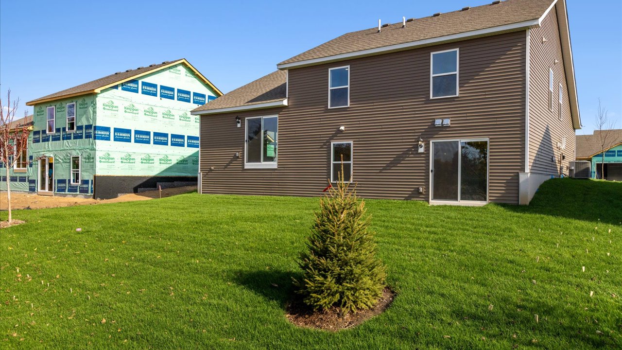 Backyard view of Rushmore home with walkout style basement.