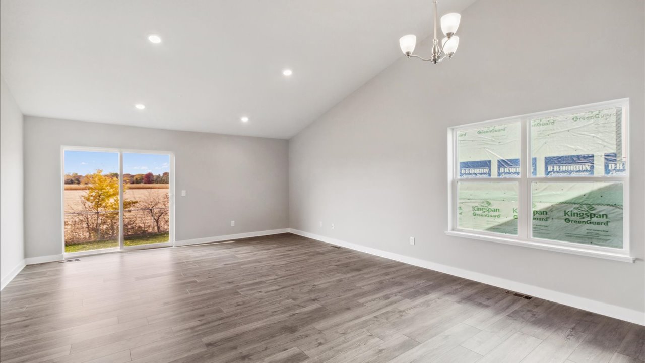 Living room view to dining kitchen and front door Ravine Crossing By D.R. Horton