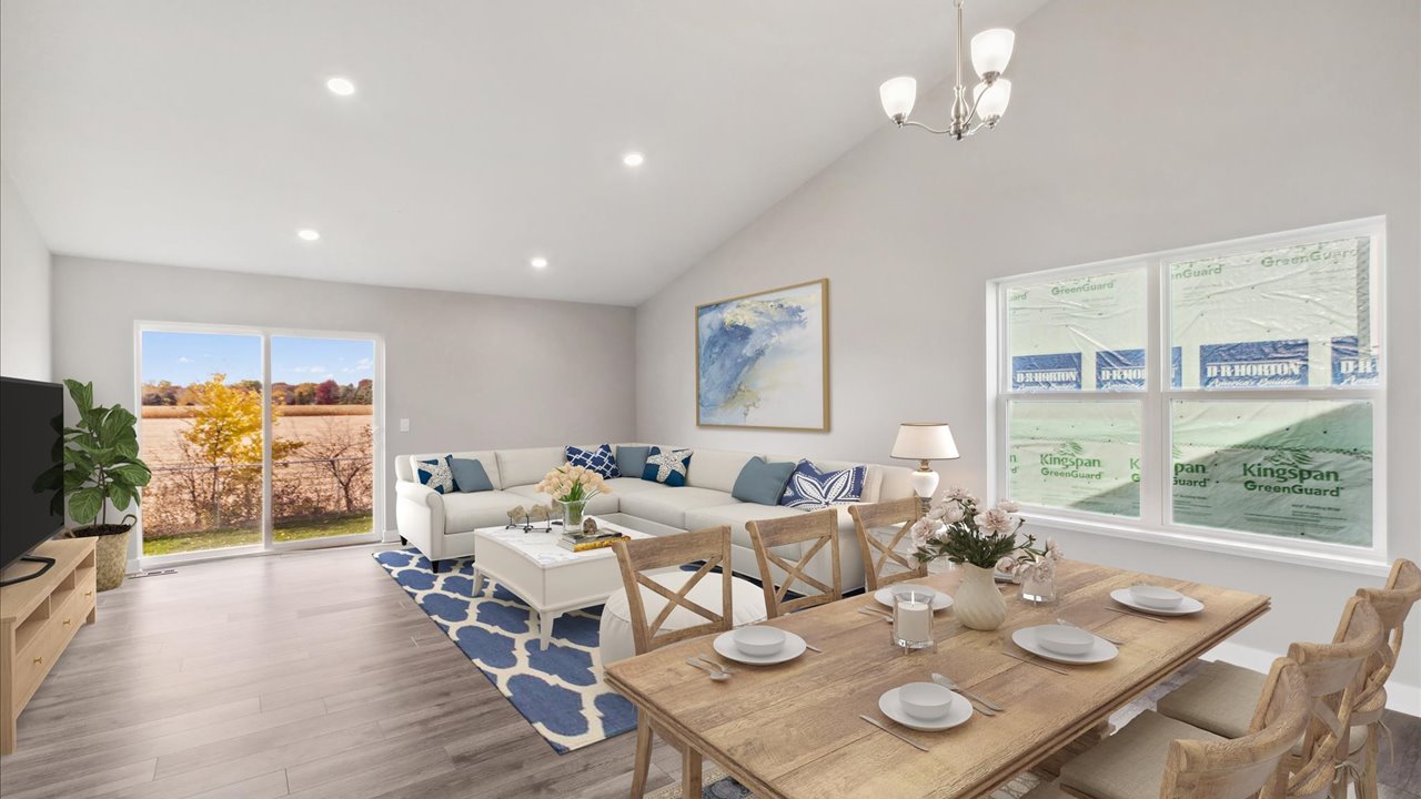 View of open concept main level with kitchen, dinette, and living room.