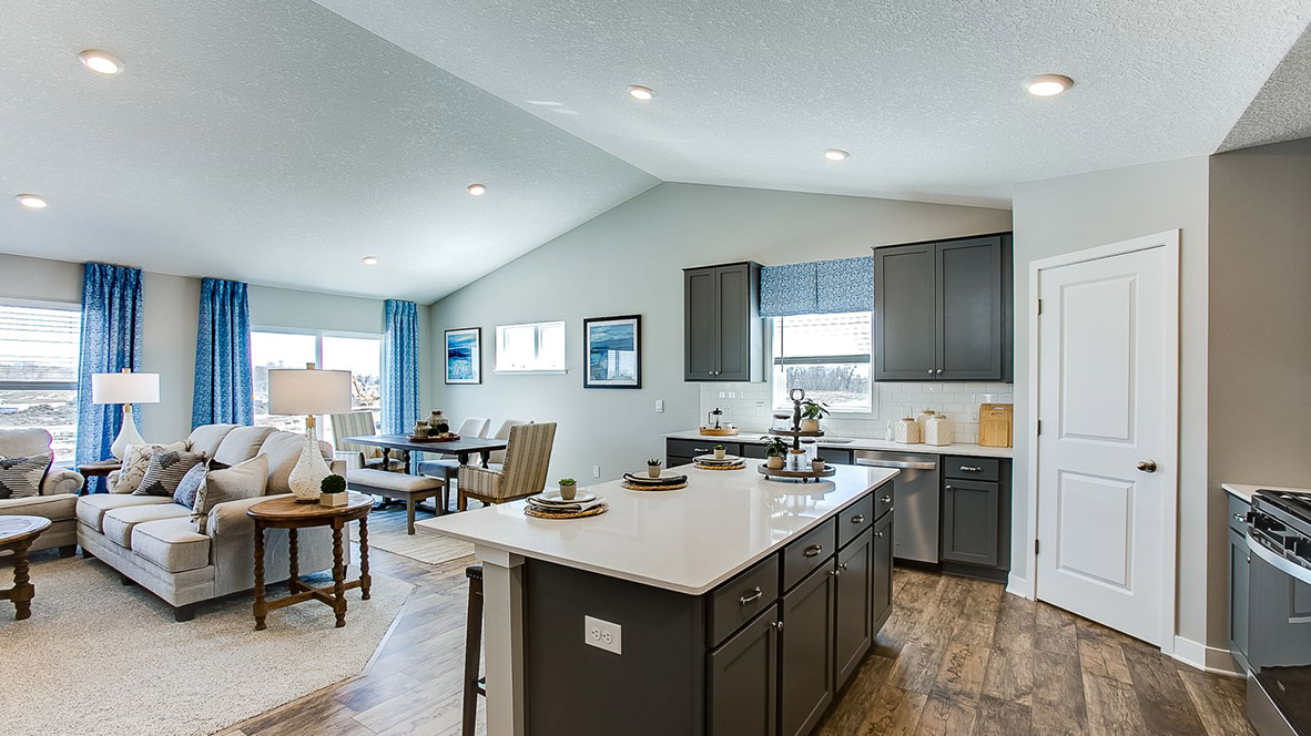 Angled view of kitchen island with harbor gray cabinetry