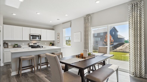 The holcombe plan kitchen and dining area.