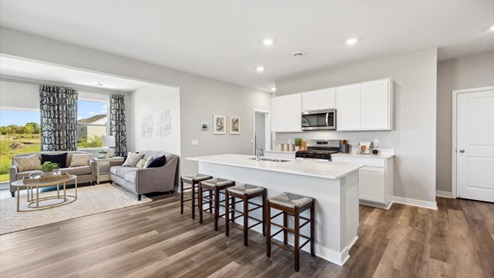 The elm open concept kitchen, dining and family room.
