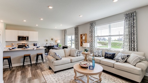 Main level open from the family room to the kitchen.