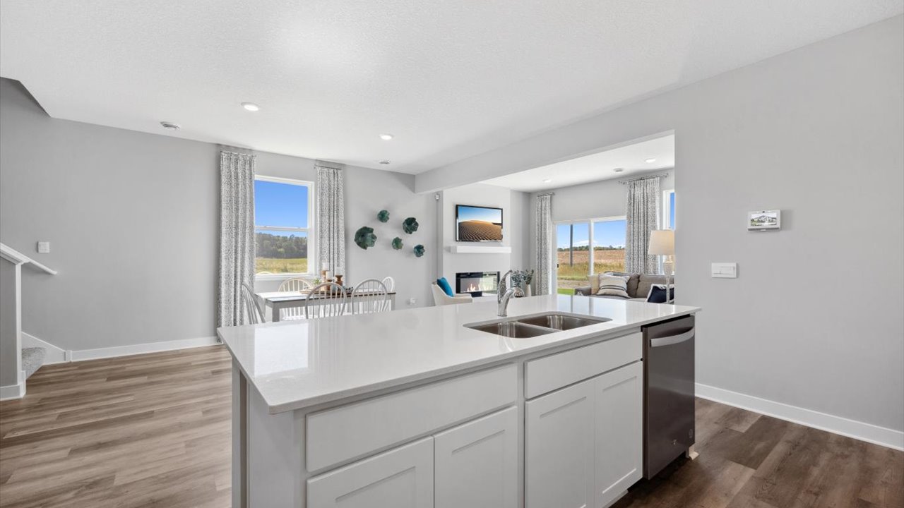 Kitchen with white cabinets and stainless steel appliances.