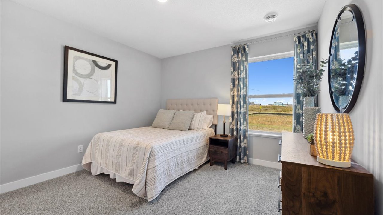 Secondary bedroom with standard closet.