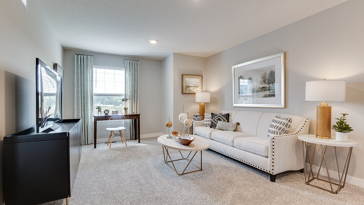 Carpeted upper level loft area.