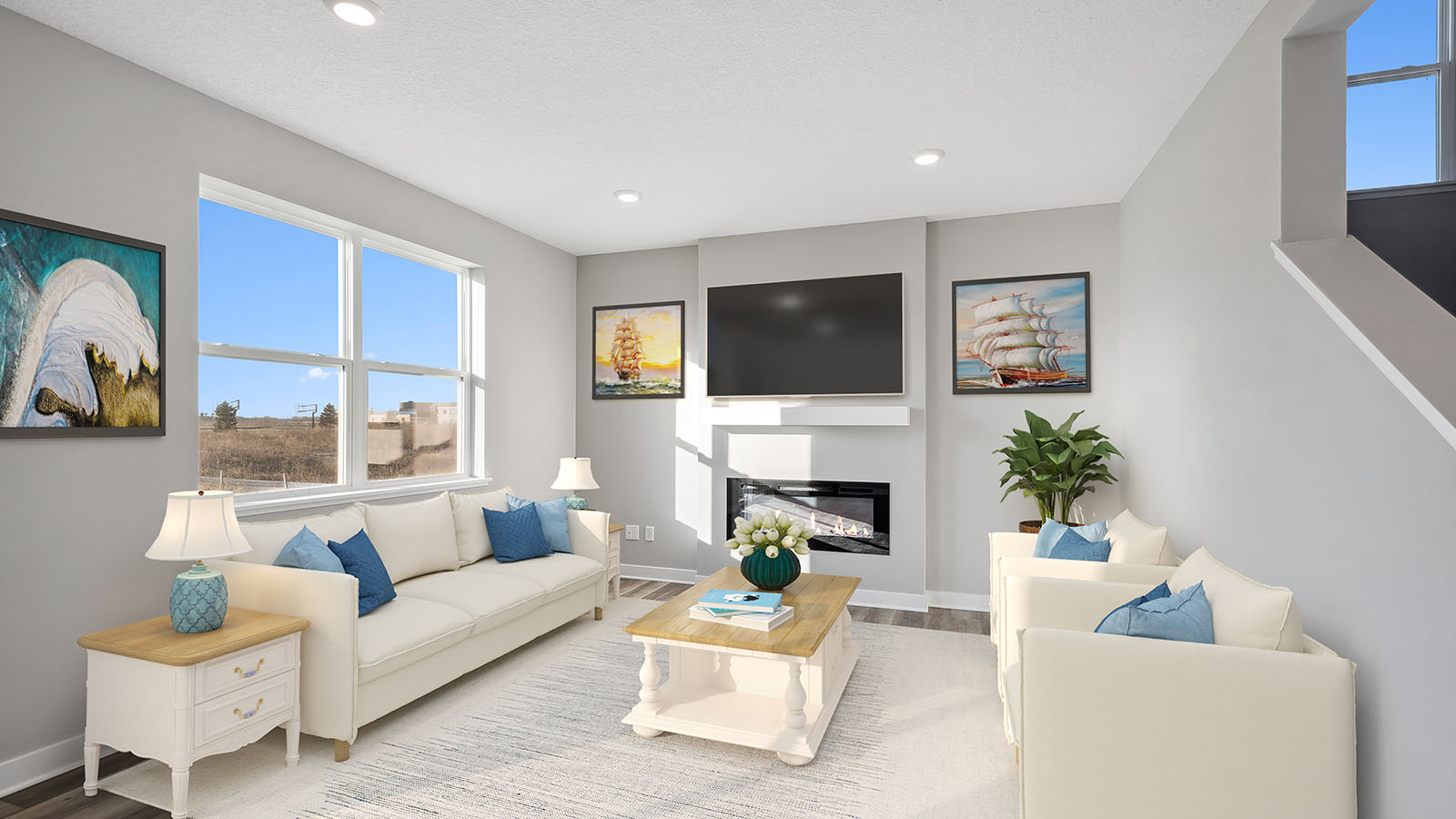 Living room in this new home features natural light, with fresh open concept with gas or electric fire place Harvest View