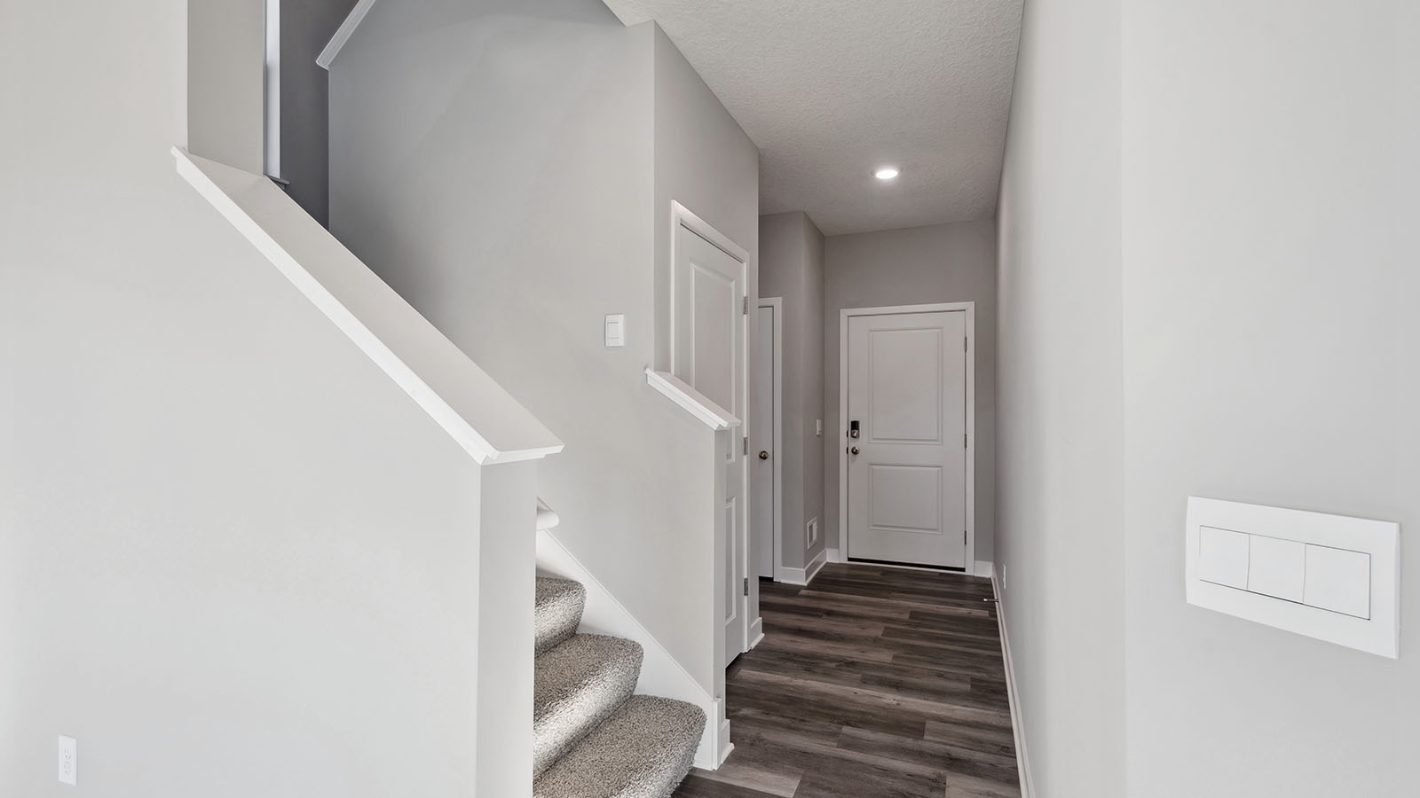 Front door view from the foyer, entry hall inside near office, or flex room adding a direct line of sight to home