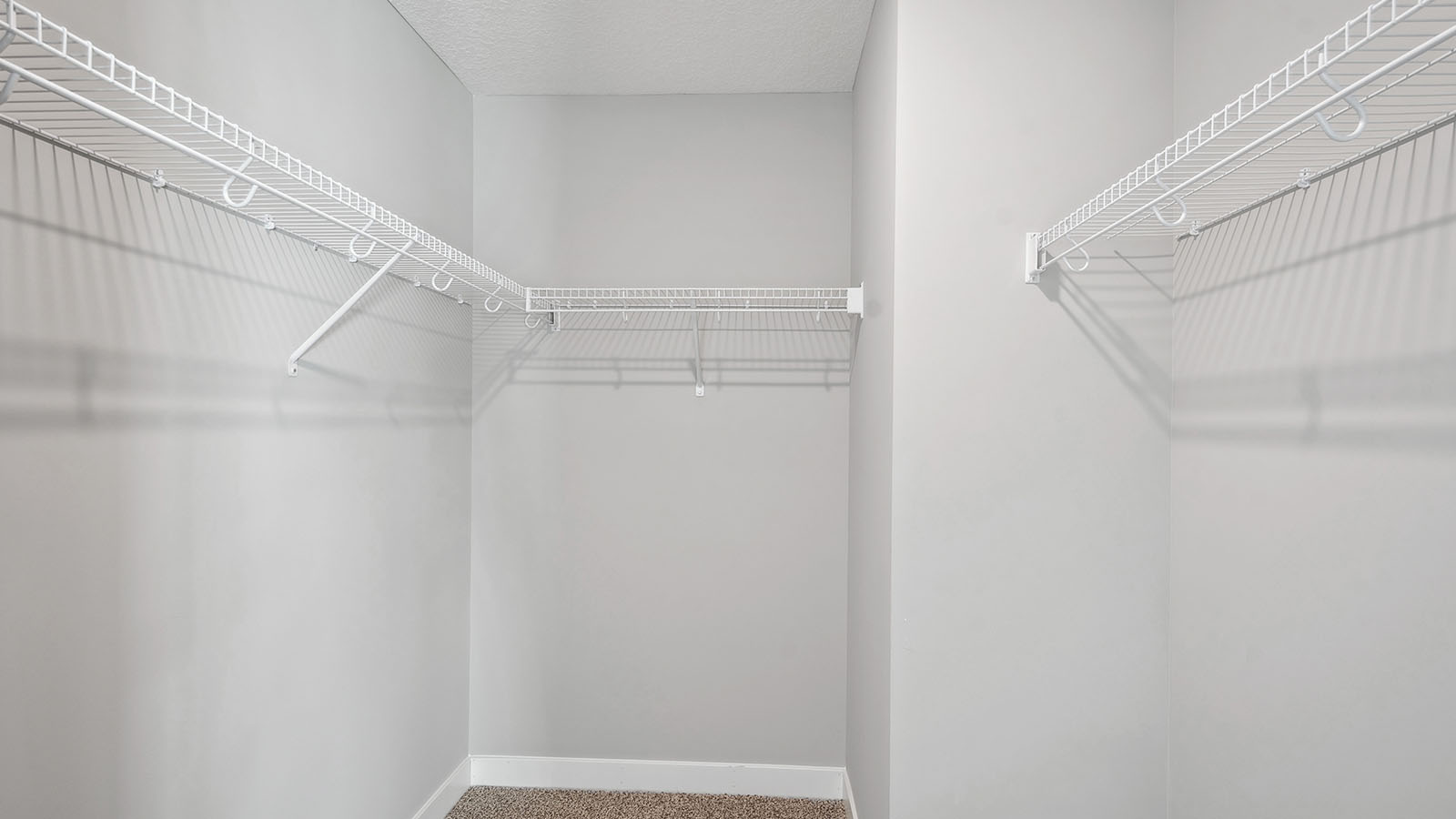 Owner’s ensuite adds quality storage inside this walk-in closet, designed for functional privacy