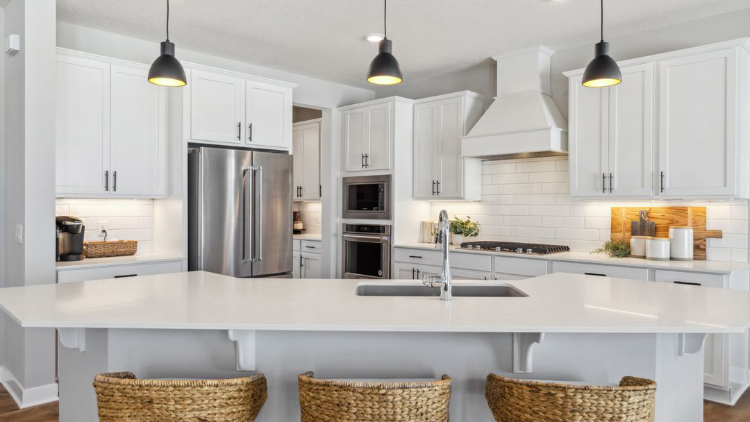 Kitchen with wood hood.