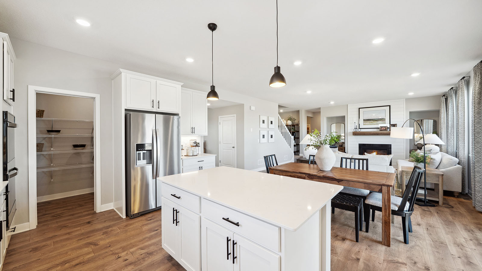 View from kitchen into dining and living areas showing fresh open design