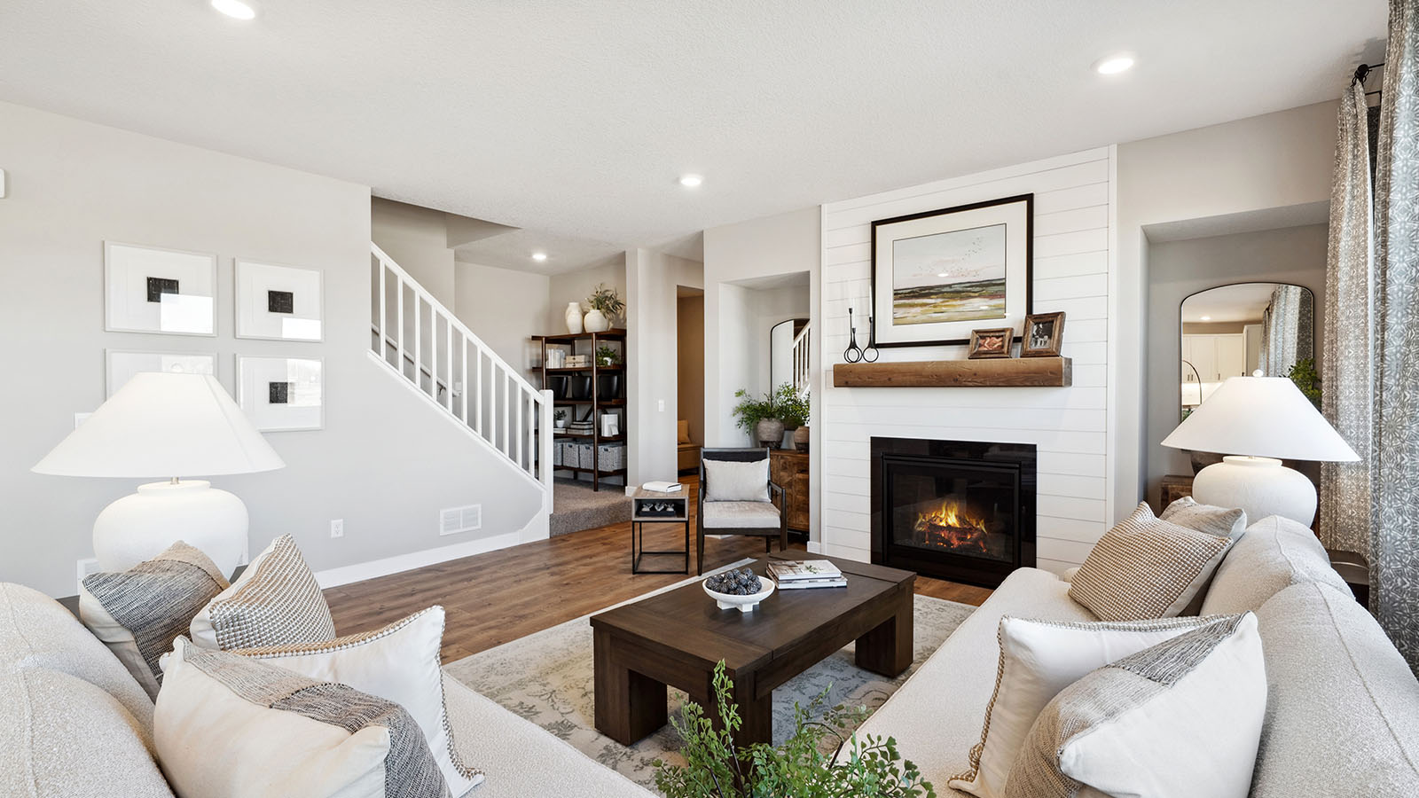 Living room featuring fireplace and stair access to loft and bedrooms