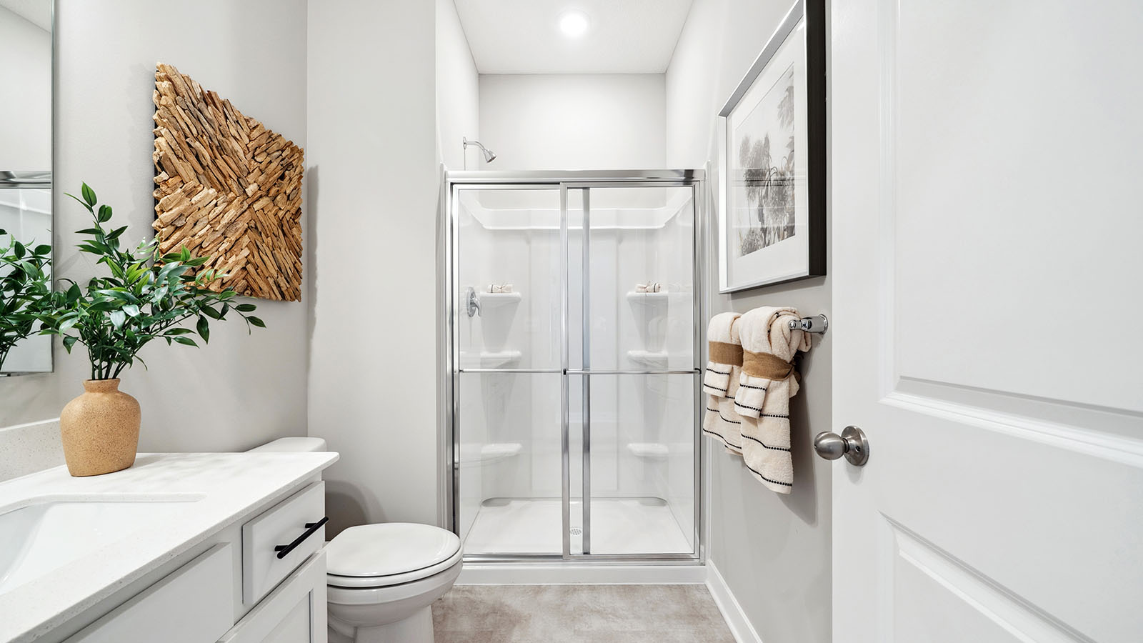 Family full upstairs bathroom adds stylish vanity, mirror, cabinets, and tub-shower combo