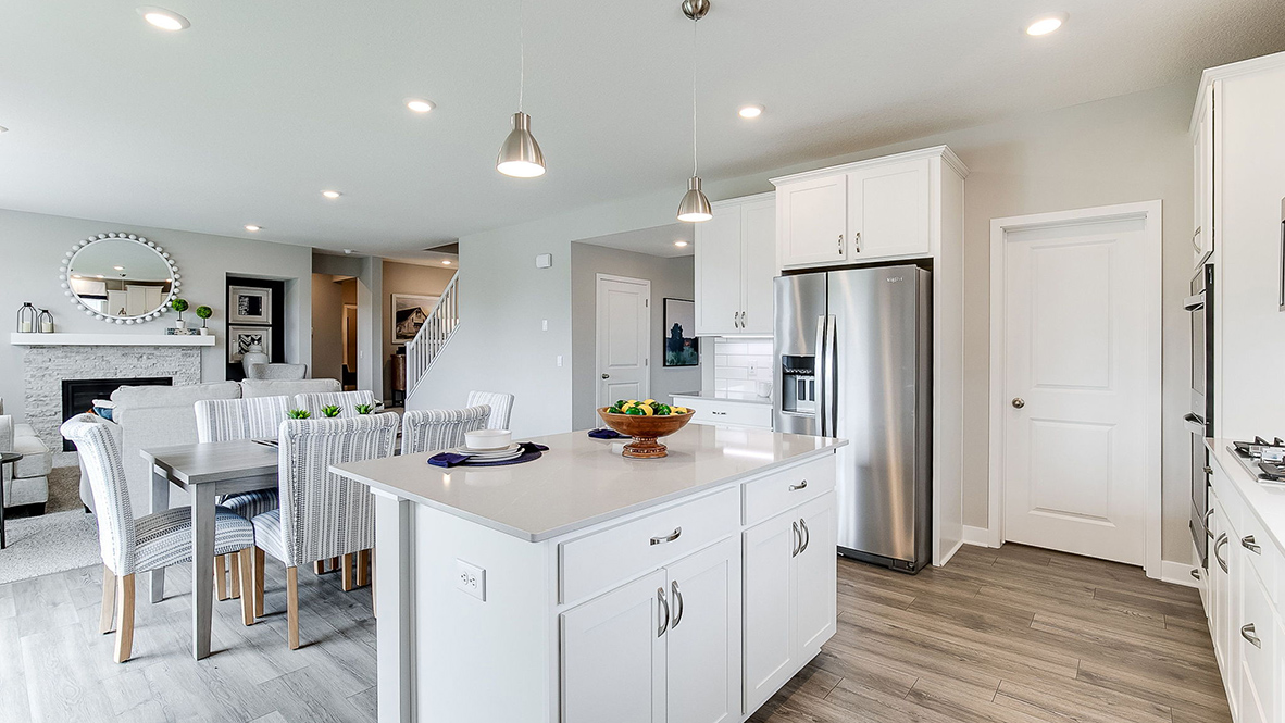 Kitchen with white cabinets and stainless steel appliances.