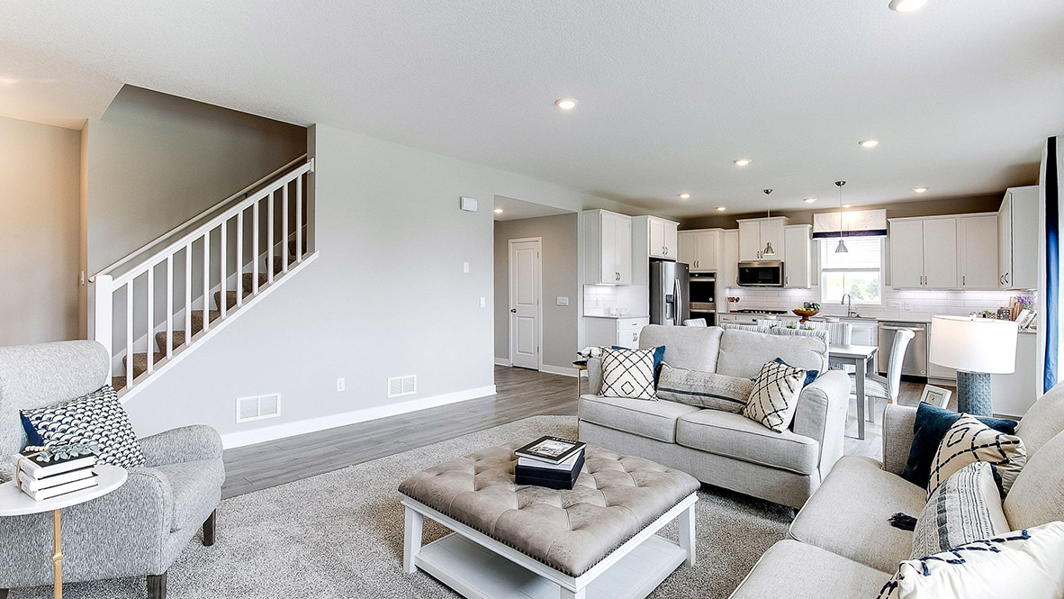 Open concept main level with living, kitchen, and dinette areas.