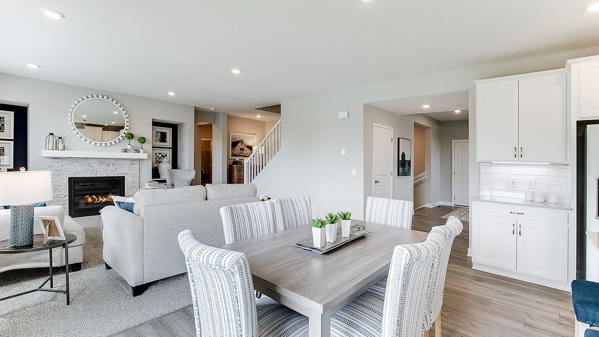 Open concept main level with living, kitchen, and dinette areas.