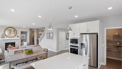 Kitchen with white cabinets and stainless steel appliances.