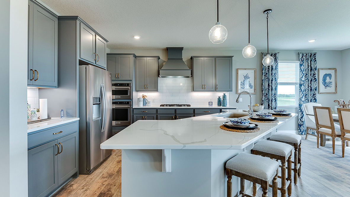 Gourmet kitchen with wood hood.